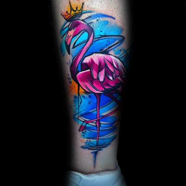 Neo-traditional flamingo tattoo with bold pink hues, a golden crown, and vibrant blue water accents, creating a striking, regal design.