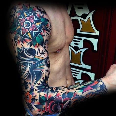 A person showing colorful, intricate arm tattoos with a geometric design and a figure