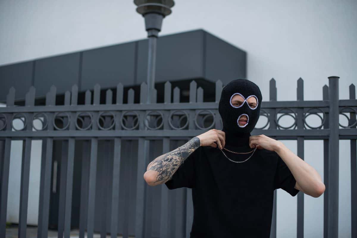 Closeup,Headshot,Of,Criminal,Wearing,Black,Balaclava,And,Hoodie,Looking