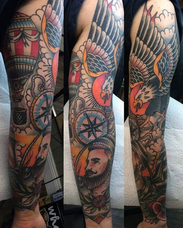 Colorful sleeve tattoo featuring an eagle, a compass, and various symbolic designs
