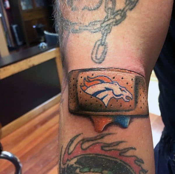 Band-Aid tattoo featuring the Denver Broncos logo with shaded edges and dripping ink for a realistic, 3D effect.