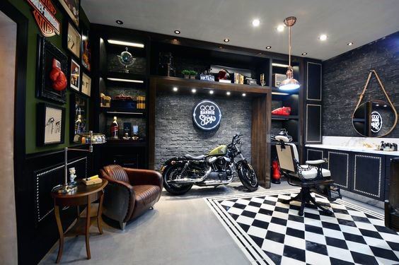 Barbershop with motorcycle display, checkered floor, and vintage decor accents.