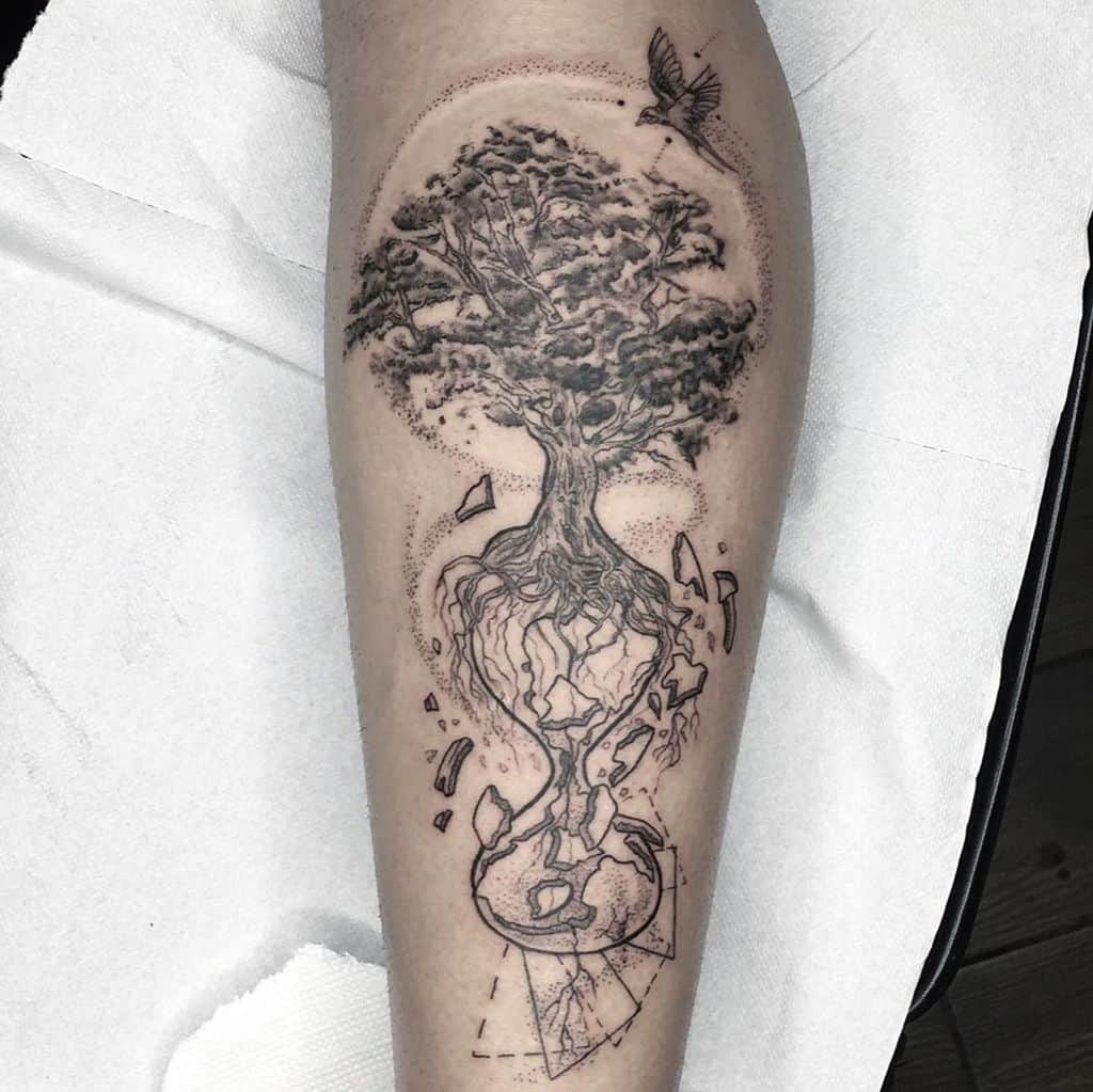 A surrealistic tree of life tattoo, where its roots intertwine with a fractured Earth, symbolizing nature’s fragility and deep connection to our world.