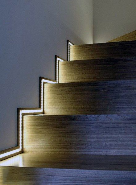 Wooden staircase with LED lights along the edges, creating a modern and illuminated effect