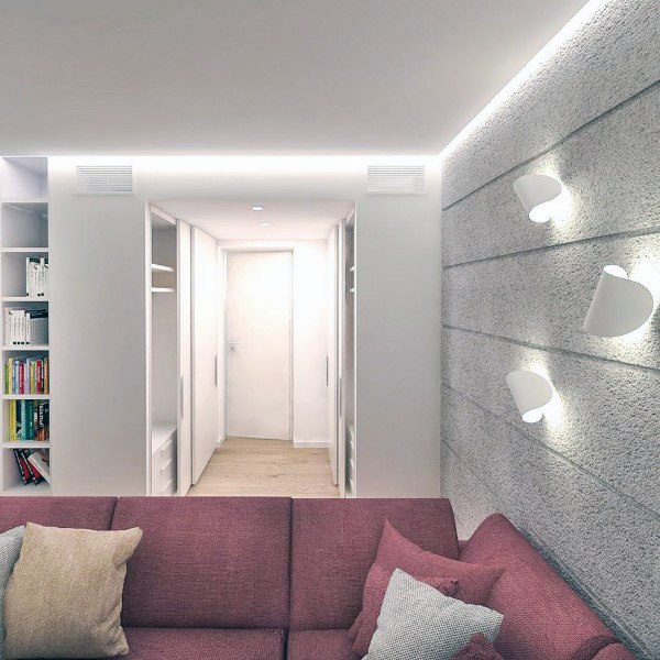 Modern basement with LED backlit ceiling, textured walls, and a cozy pink sectional sofa.