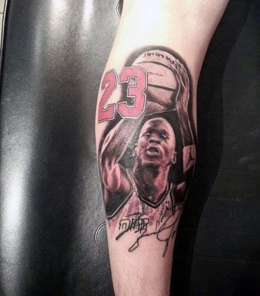 Tattoo of a basketball player holding a ball with the number 23 on the jersey