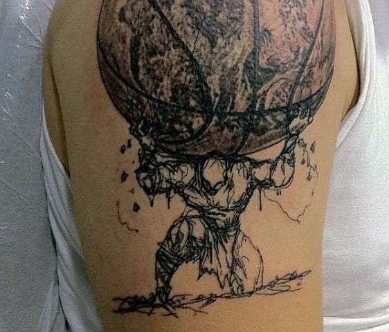 Tattoo of a muscular figure resembling Atlas holding up a large cracked basketball