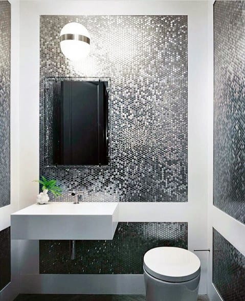silver mosaic wall tiles white sink and toilet