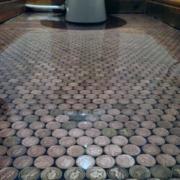 Bathroom with epoxy-coated penny tile floor creating a smooth, glossy finish.