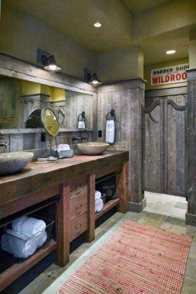 Rustic bathroom with wooden cabinets, vessel sinks, and a vintage Wildroot sign