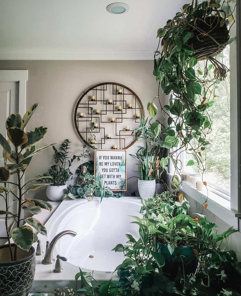 bathroom full of pot plants and viney plants round abstract candle holder 