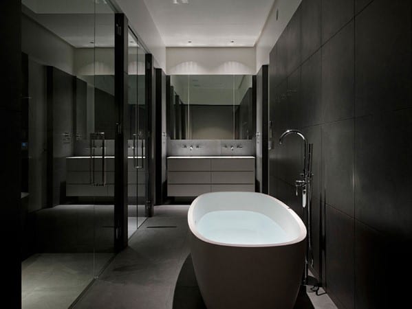 Minimalist bathroom with freestanding tub, glass shower, and modern fixtures