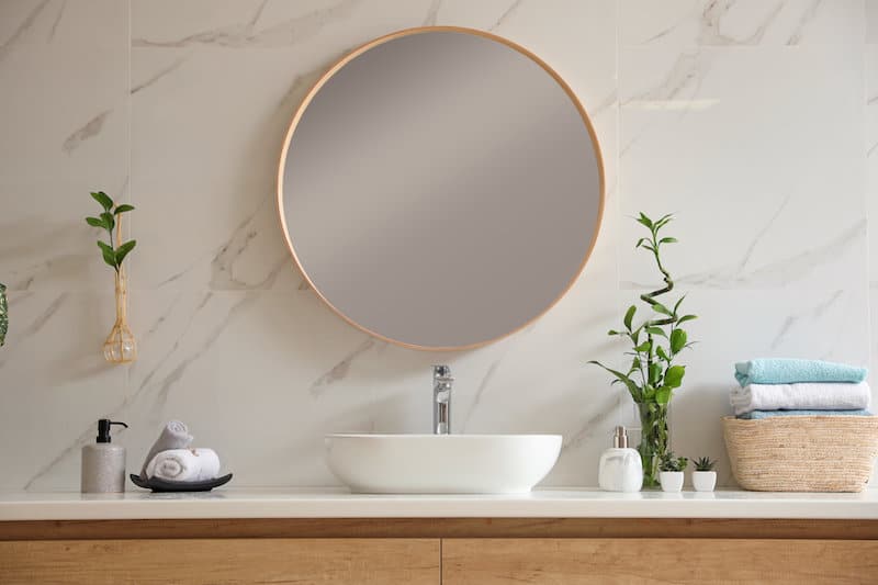 circular gold accent bathroom mirror