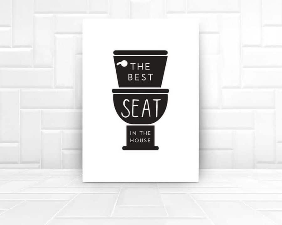 Minimalist bathroom wall art with a toilet illustration and the text "The Best Seat in the House".