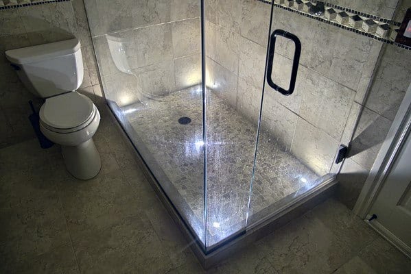 Stylish bathroom shower with LED lighting along the floor, creating a modern and luxurious ambiance