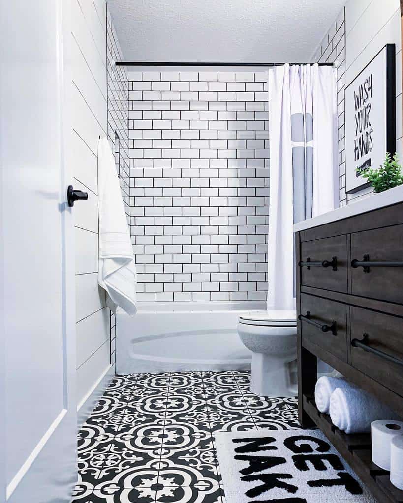 modern basement bathroom with white tile wall