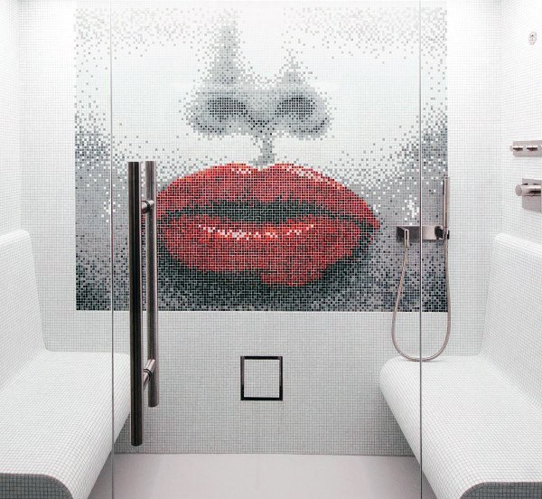 Mosaic tile shower featuring a bold red lips design with built-in benches and glass door.