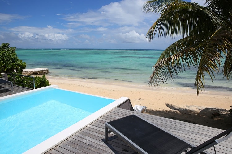 beach view above ground infinity pool deck