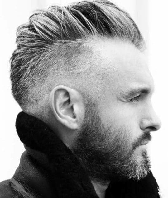 Slicked-back undercut and a well-groomed beard