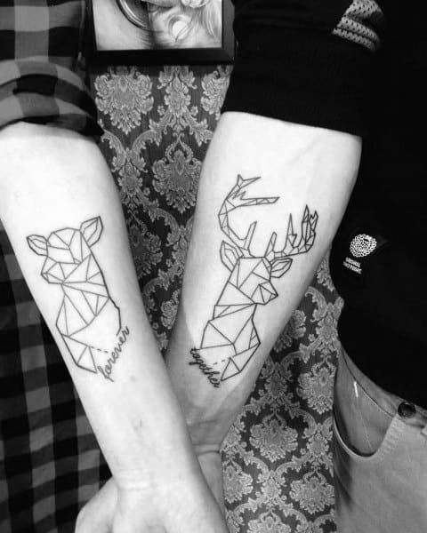 Matching geometric tattoos of a doe and a stag on forearms, symbolizing love, unity, and a strong connection between partners.
