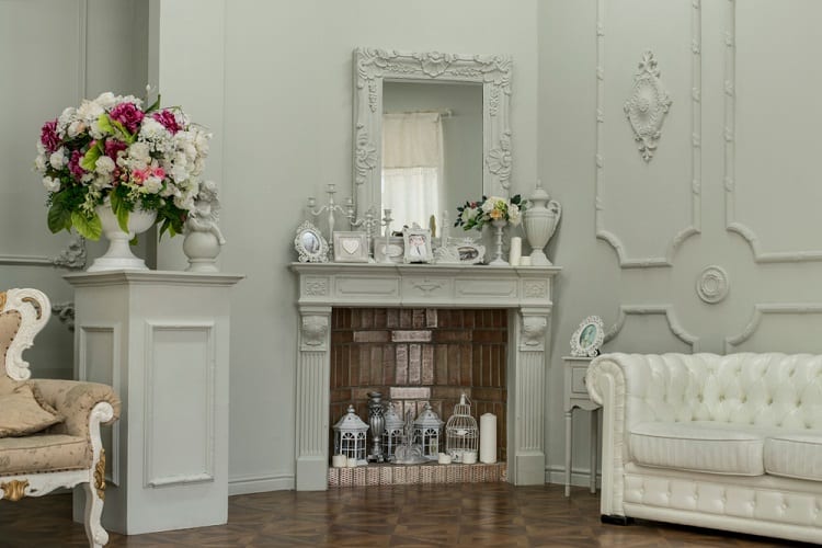 beautiful ornate fireplace and mantel in grand home