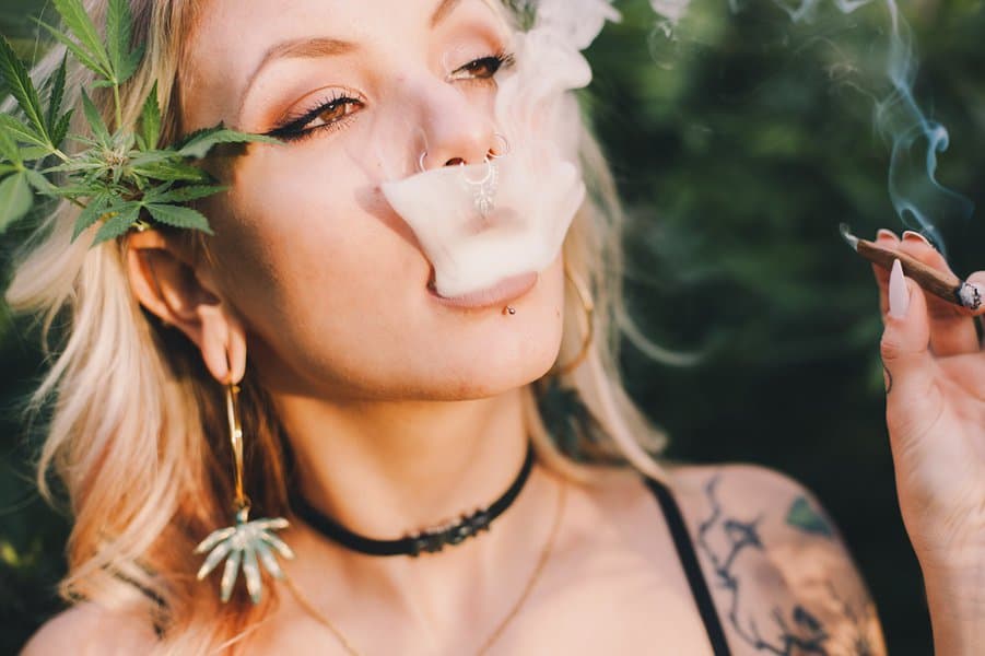 beautiful woman smoking cannabis