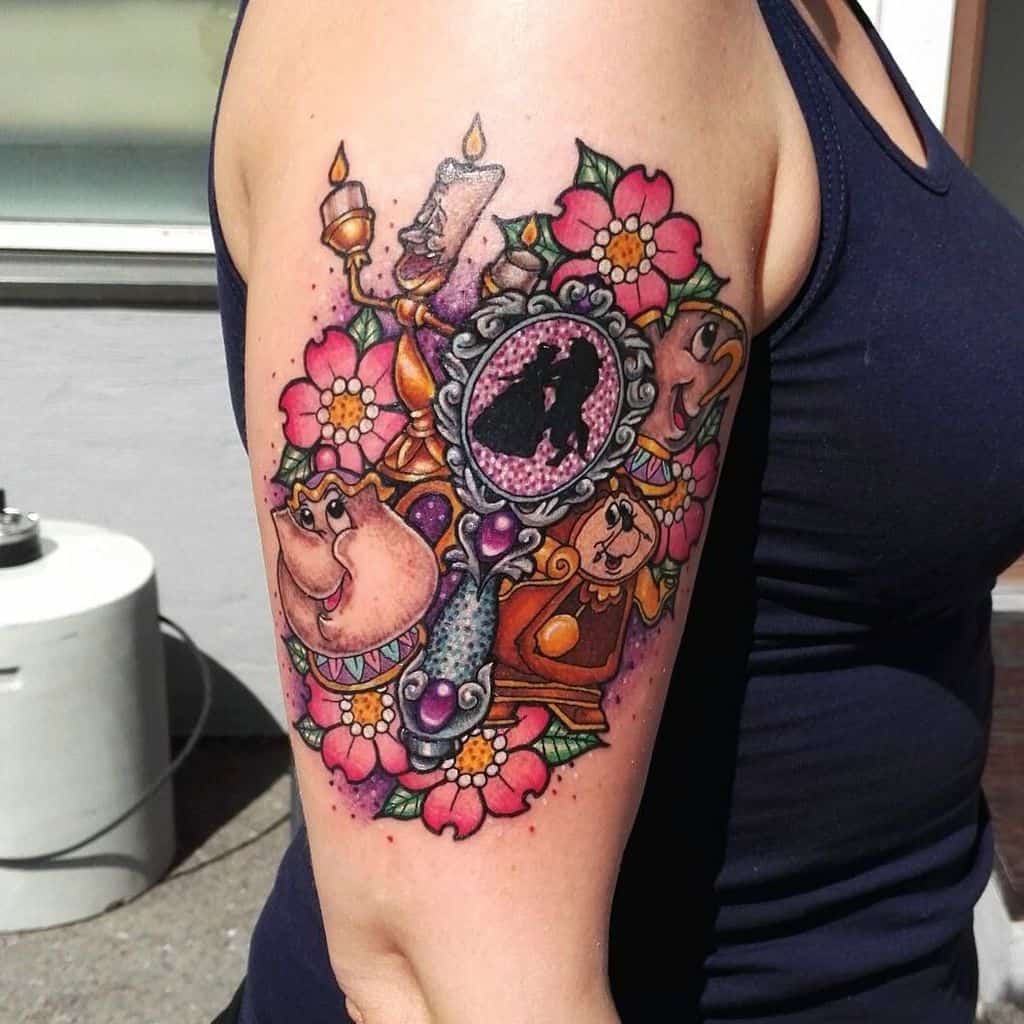 Colorful Beauty and the Beast tattoo featuring Lumière, Mrs. Potts, Cogsworth, and Chip, with floral details and a magic mirror.