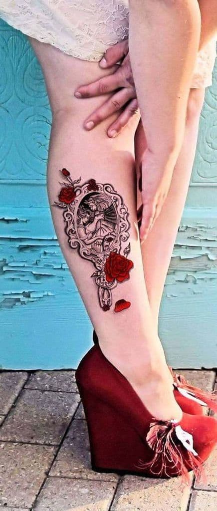 Elegant black and grey mirror tattoo featuring Belle and the Beast, accented with red roses and falling petals for a striking contrast.
