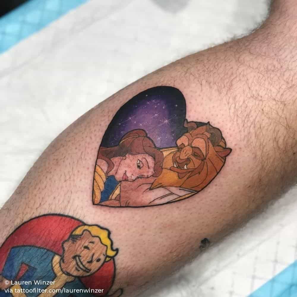 Heart-shaped tattoo of Belle and the Beast sharing a tender moment under a starry night sky, inspired by Disney’s Beauty and the Beast.