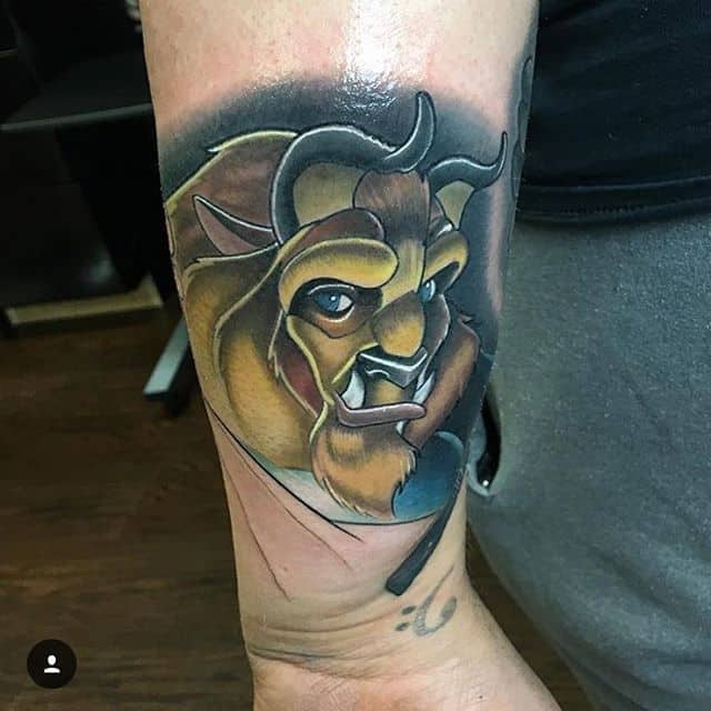 Realistic tattoo of the Beast from Beauty and the Beast, featuring bold shading, rich colors, and detailed facial expression.