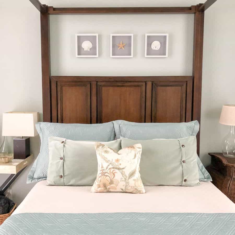 vintage wood four post bed green pillows