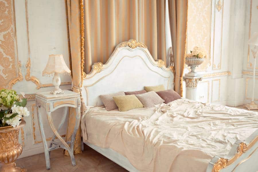 elegant french country bedroom beige colors wood bedside table 