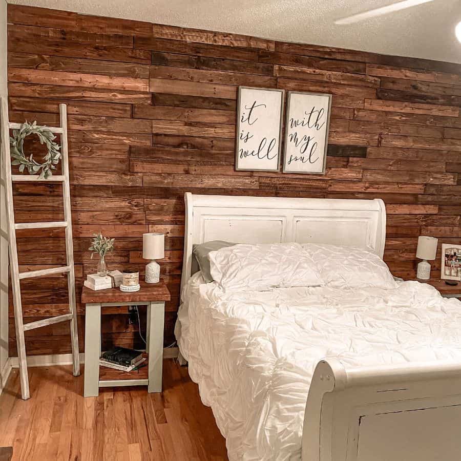 wood panel shiplap accent wall rustic bedroom with ladder decor