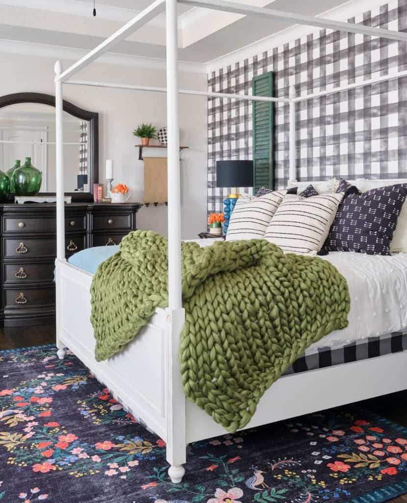 small bedroom with white four post bed