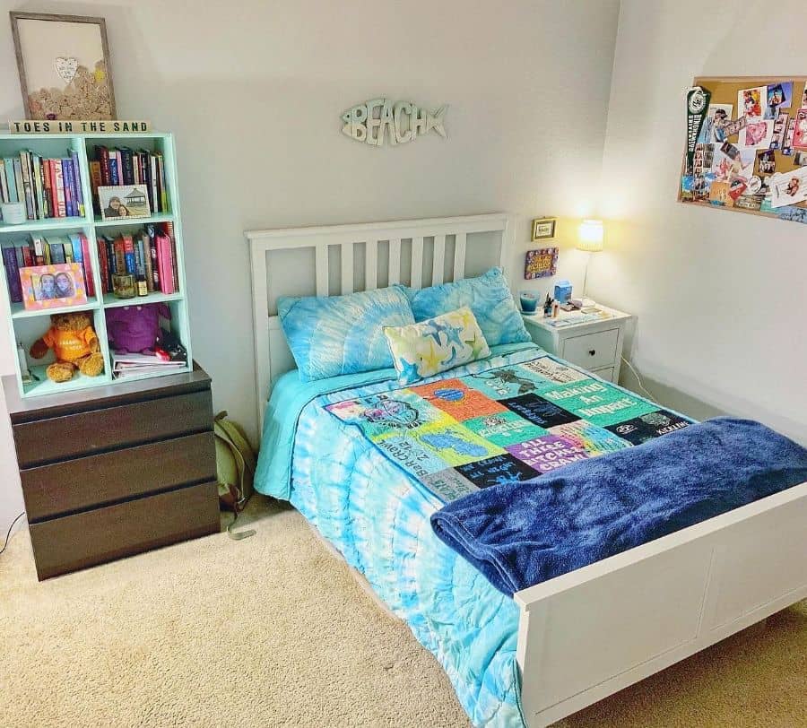 small bedroom with tall cabinet for storage