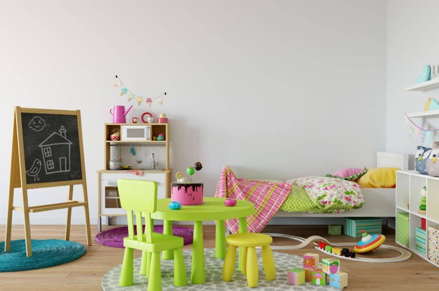 kids bedroom with chalkboard and green table and chair