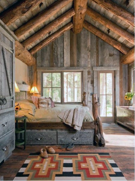 arched ceiling wood cabin with raised bed