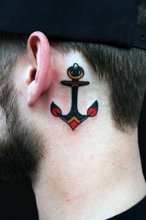 Minimalist anchor tattoo behind the ear with bold black outlines and red accents, creating a classic yet subtle nautical design.