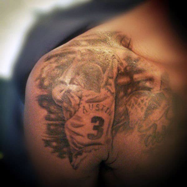 Close-up of a shoulder tattoo depicting a basketball player in a jersey with the number 3
