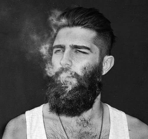 Full thick beard and slicked-back hair