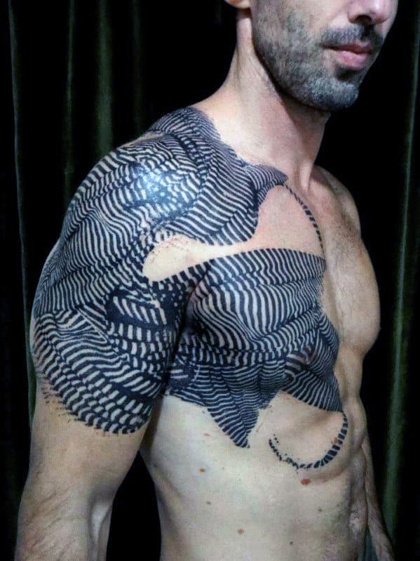 Man with a large, intricate black and white striped tattoo covering his shoulder
