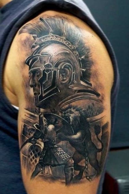 Tattoo of a Roman soldier in a helmet with a lion and a fierce gladiator fighting in the background