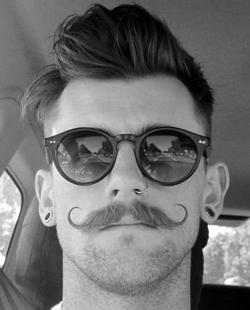 Textured pompadour with a handlebar mustache