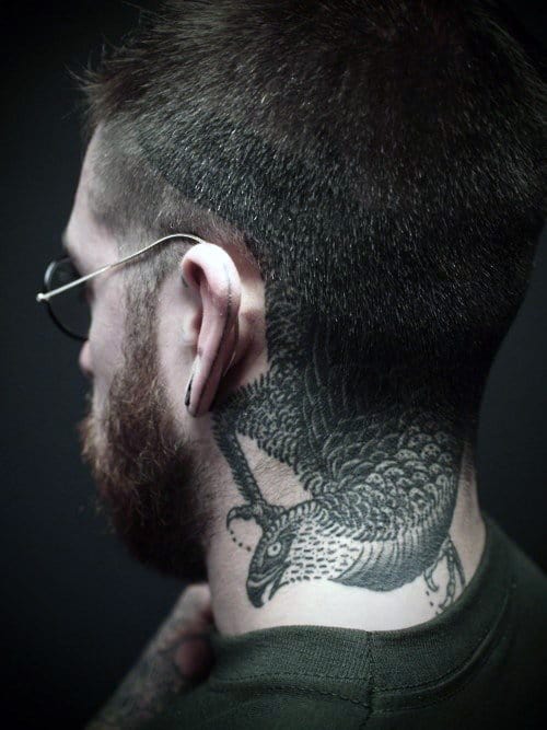 Man with a lizard tattoo on his neck