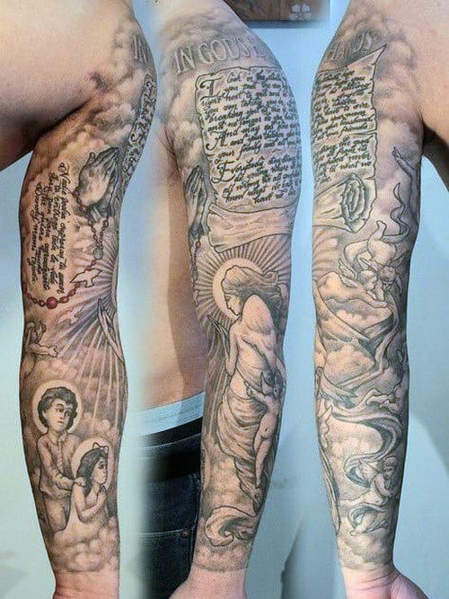 Detailed sleeve tattoo featuring angelic figures, script, and rays of light