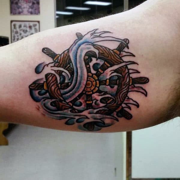 Bicep Mens Tattoo Of Ship Wheel And Water