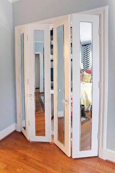 A stylish bifold closet door design with full-length mirrors, creating an elegant and space-efficient look for any room