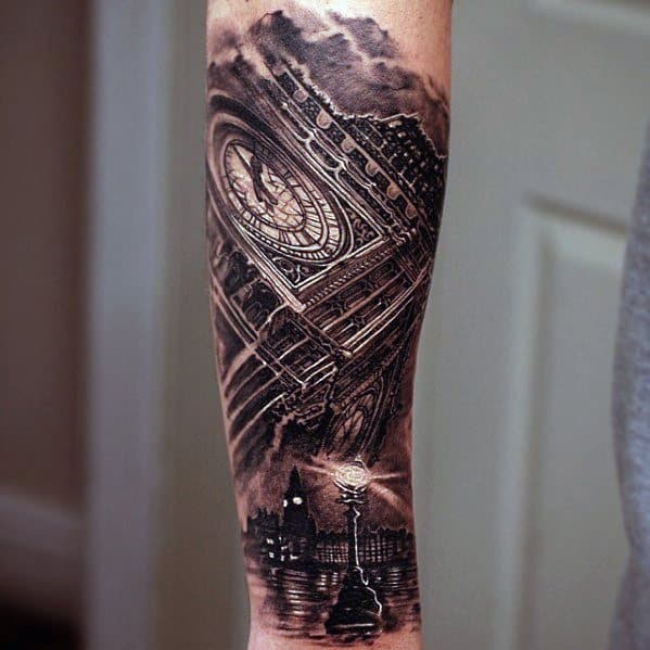 Detailed black and grey tattoo of Big Ben, tilted in perspective, with a lamp post and cityscape below, creating a moody, atmospheric scene.