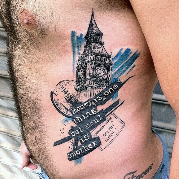 Detailed tattoo of Big Ben on the chest with a baseball, abstract brush strokes, and a quote reading, "money is one thing but soul is another."