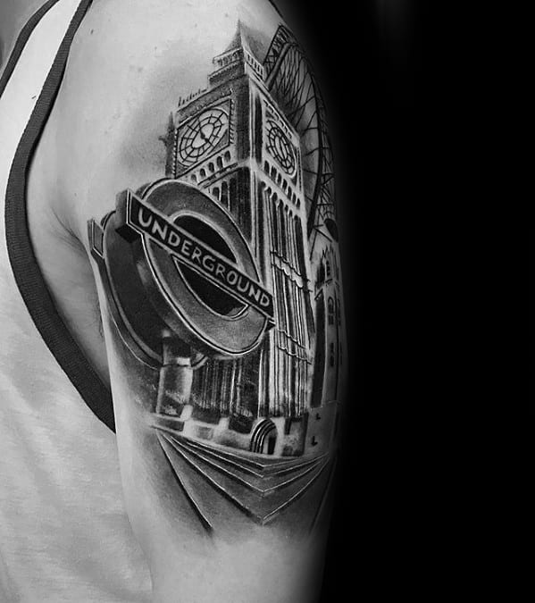 Detailed black and grey tattoo of Big Ben with a London Underground sign, capturing iconic elements of London architecture and design.